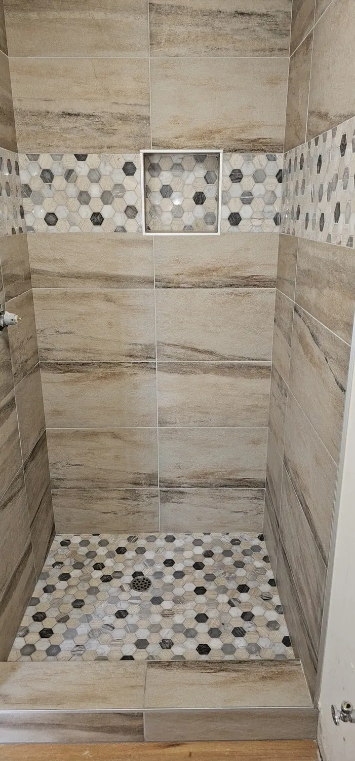 Close view of aligned large-format shower tile